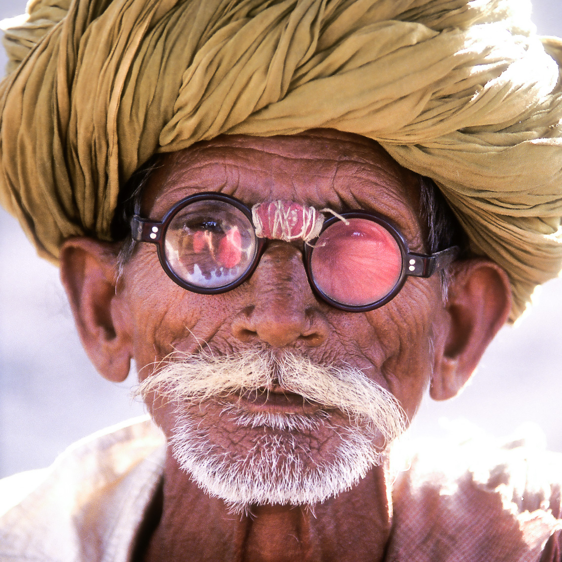 TP_1-3.  Memorable image of this old man with his improvised glasses-  Jasilmere, India.